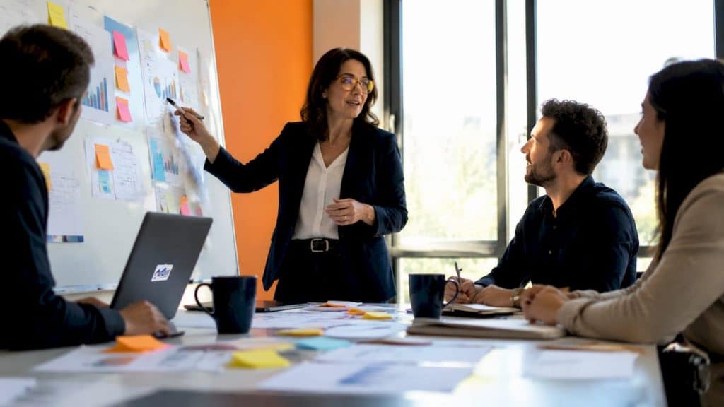 Marketing manager at desk planning pain clinic campaign