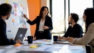 Marketing manager at desk planning pain clinic campaign