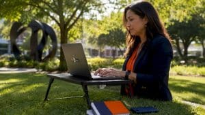 Marketer typing SEO strategy at home desk