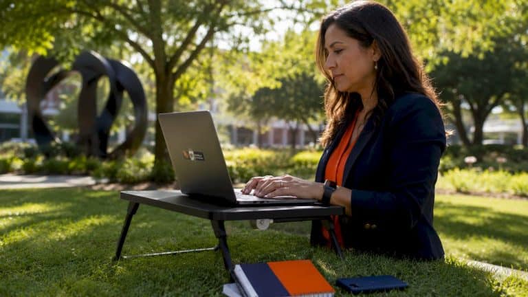 Marketer typing SEO strategy at home desk
