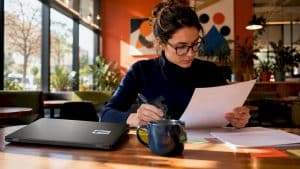Woman reviewing privacy policy document at desk