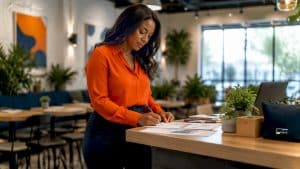 Woman reviewing medical marketing strategy documents
