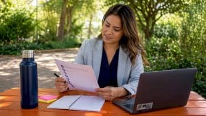 Healthcare manager reviewing marketing checklist
