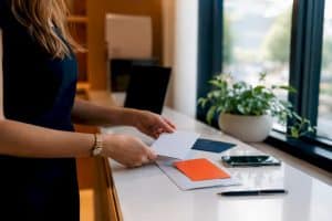 Hands arranging email marketing materials