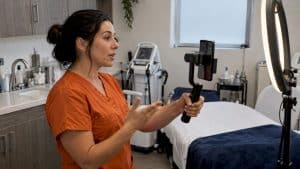 Med spa clinician filming a short-form Reel