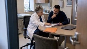 Clinic owner reviewing a phased SEO timeline