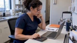Med spa owner reviewing an advertising budget