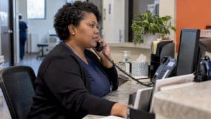 Clinic coordinator answering a patient call