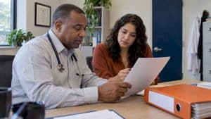 Clinic leaders reviewing pain clinic advertising rules